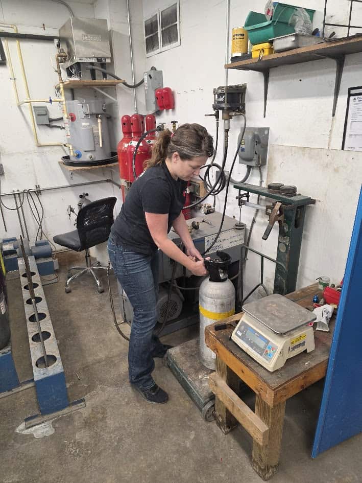 Beverage CO2 cylinders arranged for hydrostatic testing and refill at Serviced Fire Equipment