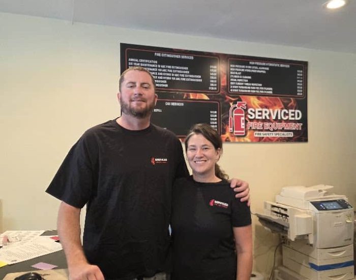 Daniel and Hailey at the front desk of Serviced Fire Equipment in St. Petersburg, FL